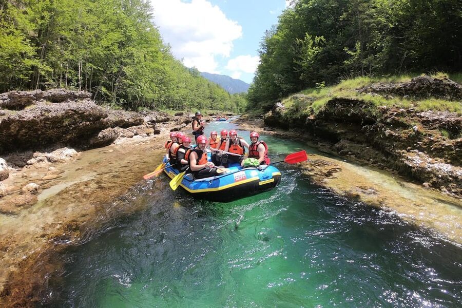 Adventurous rafting tour on the Salza - pure whitewater action! - Gear fitting: wetsuit, neoprene shoes, helmet, and paddle