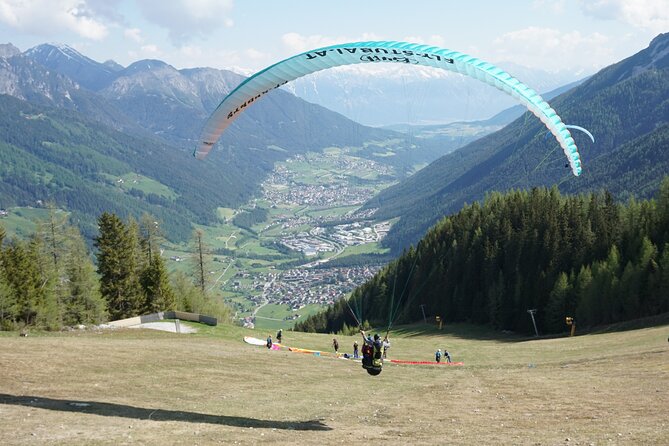 Paragliding in the morning - Safety gear and a pilot with 25,000 tandem flights
