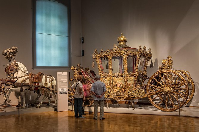 Skip the Line:Imperial Carriage Museum by Schönbrunn Kaiserliche Wagenburg Wien - The baroque Imperial Coach, and the range beyond it