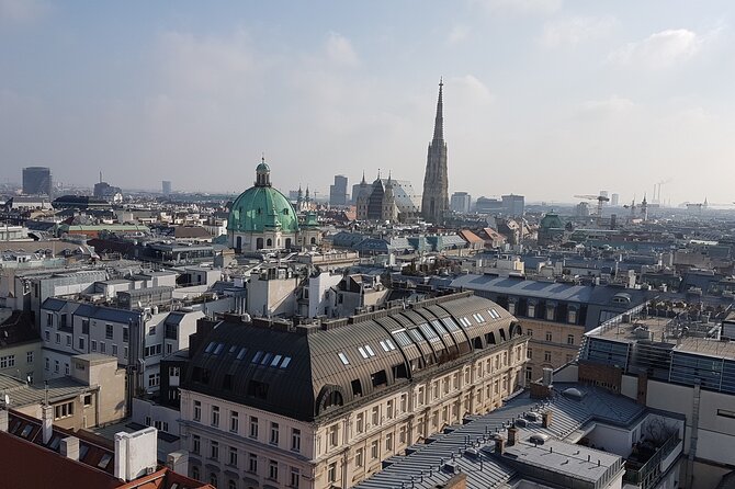 Vienna Secrets Walking Tour to Backyards and Mysterious Locations - Ballgasse, the Franciscan Church façade, and the modern wink of a cat café