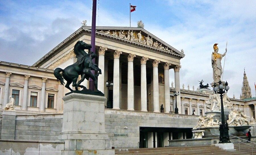 Vienna: Walking Tour of the Historic Ringstrasse - Votive Church and the University of Vienna: symbols you can read